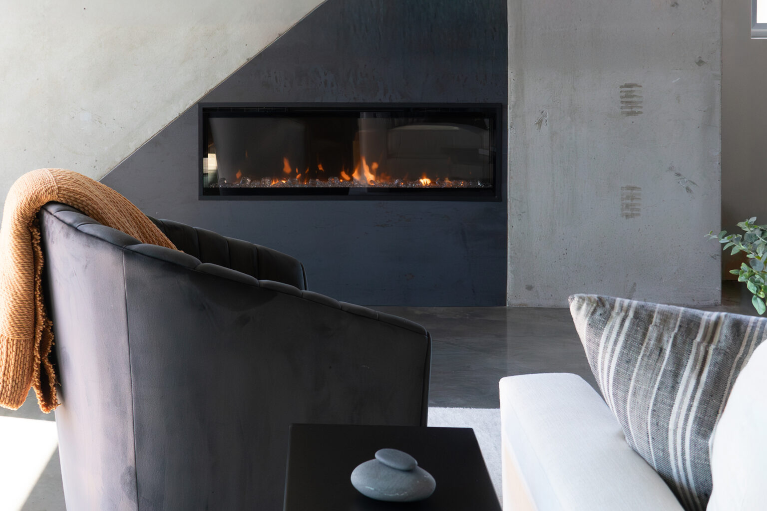 Living room with modern fireplace and upholstered seating